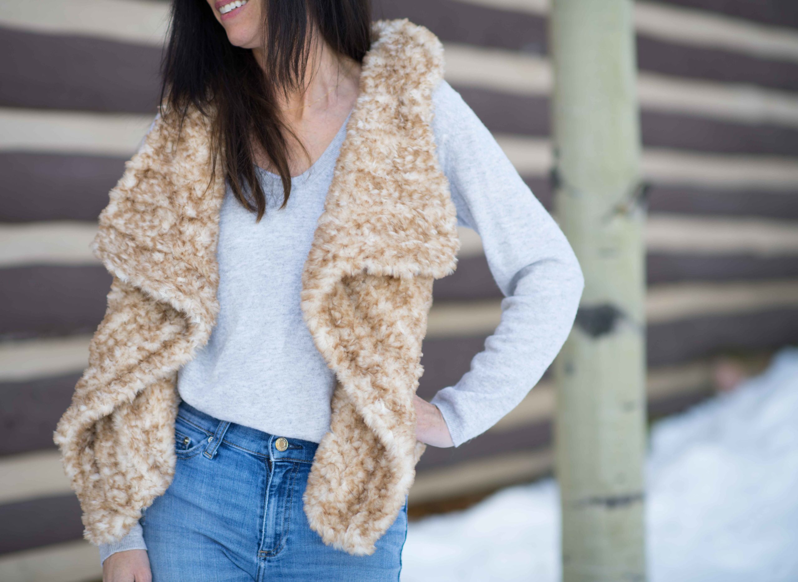 The Mika Vest, a festive hooded faux fur crochet vest pattern - TL